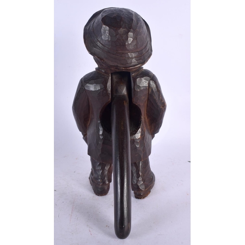 353 - A PAIR OF ANTIQUE BAVARIAN BLACK FOREST NUT CRACKERS. 23 cm high.