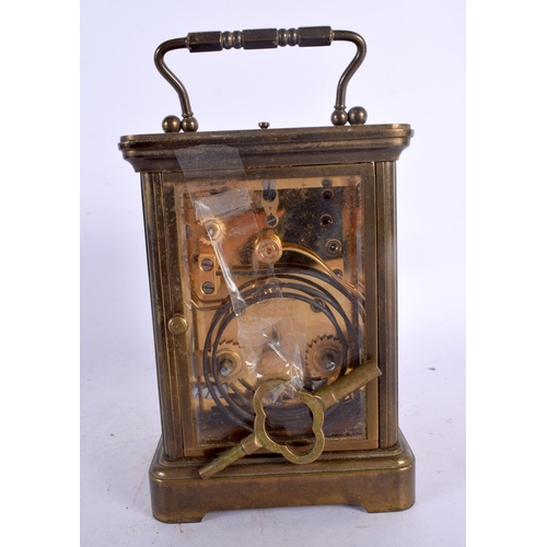 355 - A MATTHEW NORMAN REPEATING CARRIAGE CLOCK. 17 cm high inc handle.