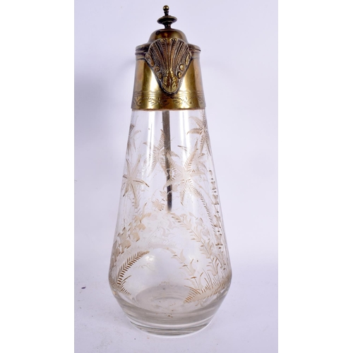 359 - AN AESTHETIC MOVEMENT ENGRAVED GLASS CLARET JUG. 27 cm high.