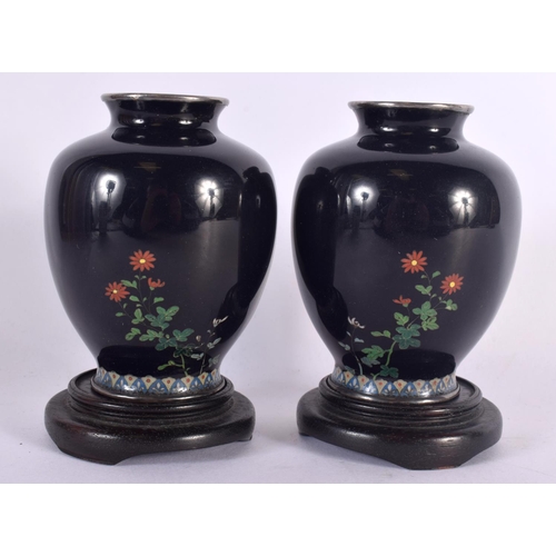 360 - A PAIR OF EARLY 20TH CENTURY JAPANESE SILVER MOUNTED CLOISONNE ENAMEL VASES decorated with foliage. ... 