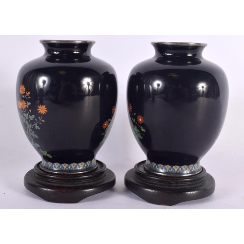 360 - A PAIR OF EARLY 20TH CENTURY JAPANESE SILVER MOUNTED CLOISONNE ENAMEL VASES decorated with foliage. ... 