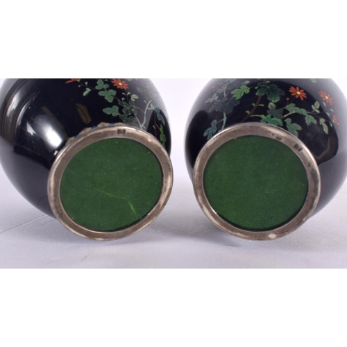 360 - A PAIR OF EARLY 20TH CENTURY JAPANESE SILVER MOUNTED CLOISONNE ENAMEL VASES decorated with foliage. ... 