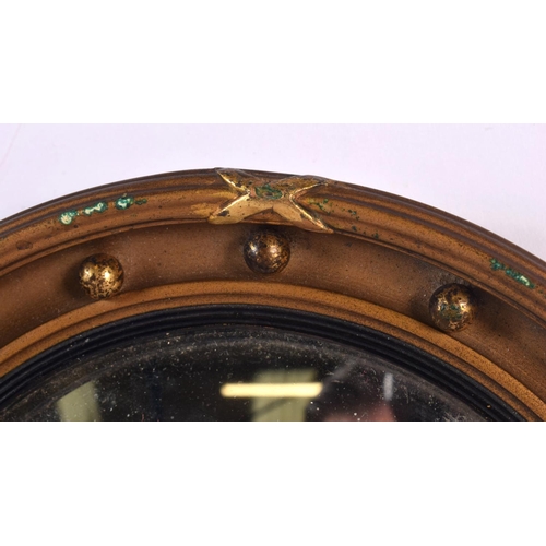 361 - A MINIATURE REGENCY STYLE GILT MIRROR. 16.5 cm diameter.