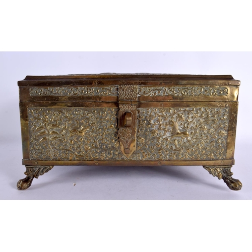 365 - A LARGE 19TH CENTURY INDIAN EMBOSSED COUNTRY HOUSE GILT METAL OVERLAID CASKET decorated with hunting... 