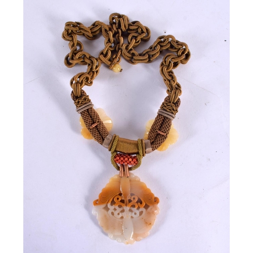 374 - A LOVELY EARLY 20TH CENTURY CHINESE CARVED TWO TONE AGATE NECKLACE with coral fittings. 62 cm long, ... 