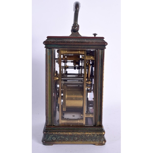 375 - A FINE 19TH CENTURY REPEATING BRASS CARRIAGE CLOCK with alarm, engraved all over with foliage and vi... 