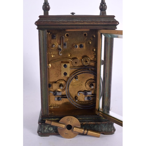 375 - A FINE 19TH CENTURY REPEATING BRASS CARRIAGE CLOCK with alarm, engraved all over with foliage and vi... 