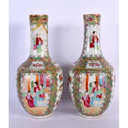 38 - A PAIR OF 19TH CENTURY CHINESE CANTON FAMILLE ROSE VASES painted with figures. 26 cm high.