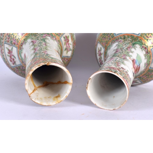 38 - A PAIR OF 19TH CENTURY CHINESE CANTON FAMILLE ROSE VASES painted with figures. 26 cm high.