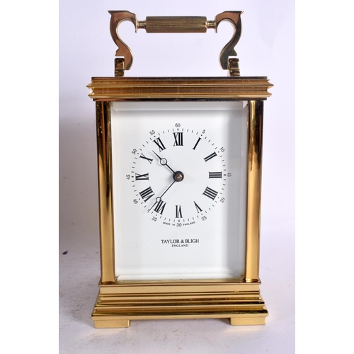 382 - A BOXED TAYLOR & BLIGH CARRIAGE CLOCK. 17 cm high inc handle.