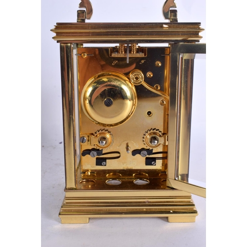 382 - A BOXED TAYLOR & BLIGH CARRIAGE CLOCK. 17 cm high inc handle.