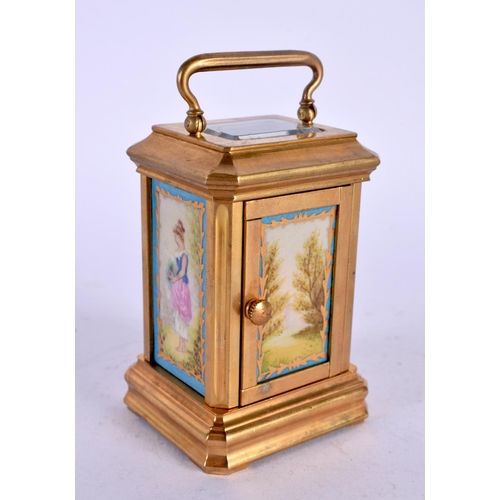 393 - A CONTEMPORARY SEVRES STYLE MINIATURE CARRIAGE CLOCK. 9 cm high inc handle.