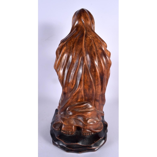 396 - A LATE 19TH CENTURY CONTINENTAL CARVED WOOD FIGURE OF A SAINT modelled with hands clasped. 40 cm x 1... 