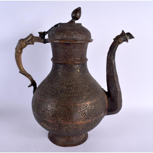 397 - A LARGE 18TH CENTURY MIDDLE EASTERN ISLAMIC BRONZE EWER decorated all over with foliage and vines. 3... 