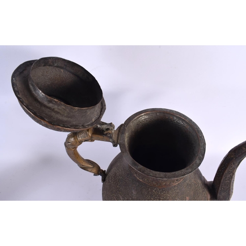 397 - A LARGE 18TH CENTURY MIDDLE EASTERN ISLAMIC BRONZE EWER decorated all over with foliage and vines. 3... 