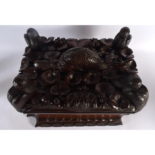 408 - A LARGE 19TH CENTURY CONTINENTAL CARVED WOOD CASKET possibly Italian, formed with a fish beside four... 