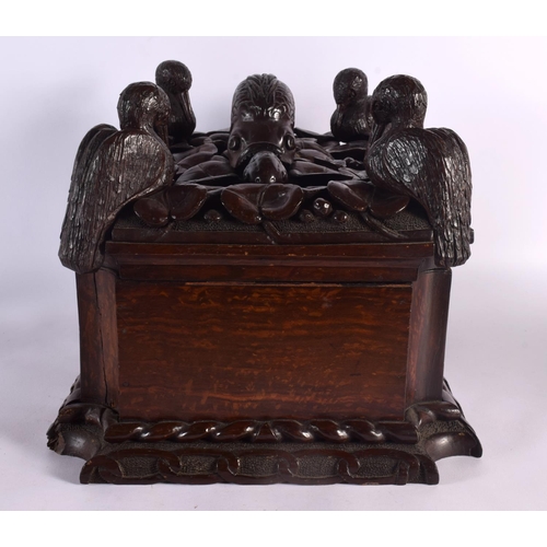 408 - A LARGE 19TH CENTURY CONTINENTAL CARVED WOOD CASKET possibly Italian, formed with a fish beside four... 