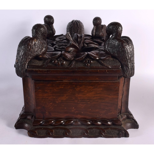 408 - A LARGE 19TH CENTURY CONTINENTAL CARVED WOOD CASKET possibly Italian, formed with a fish beside four... 