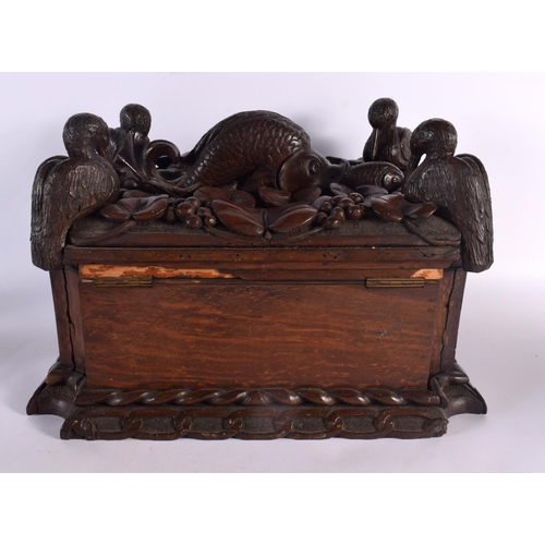 408 - A LARGE 19TH CENTURY CONTINENTAL CARVED WOOD CASKET possibly Italian, formed with a fish beside four... 