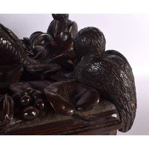 408 - A LARGE 19TH CENTURY CONTINENTAL CARVED WOOD CASKET possibly Italian, formed with a fish beside four... 