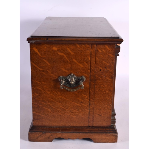 410 - A LOVELY LATE VICTORIAN GENTLEMAN'S OAK DESK CABINET the top rising, to reveal a fall front with pop... 