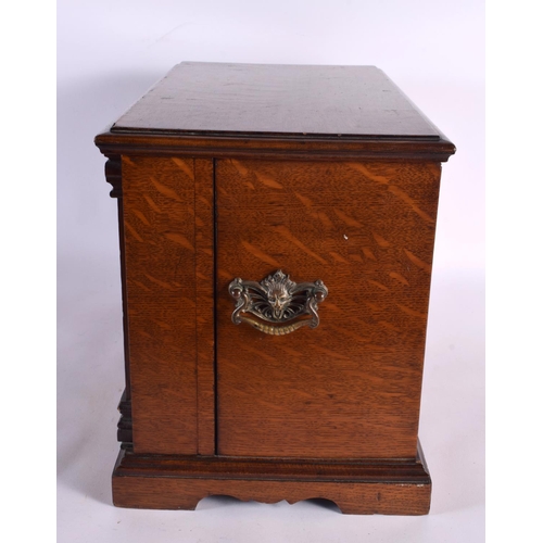 410 - A LOVELY LATE VICTORIAN GENTLEMAN'S OAK DESK CABINET the top rising, to reveal a fall front with pop... 
