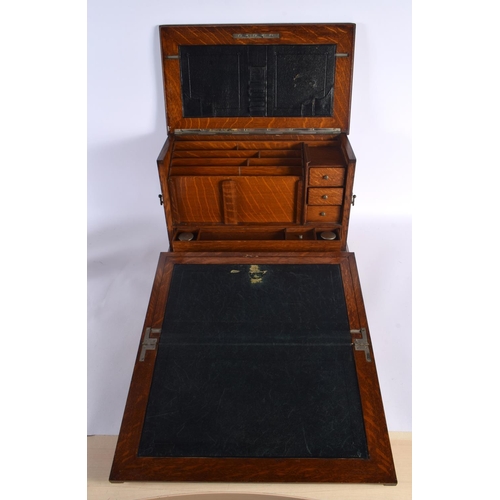 410 - A LOVELY LATE VICTORIAN GENTLEMAN'S OAK DESK CABINET the top rising, to reveal a fall front with pop... 