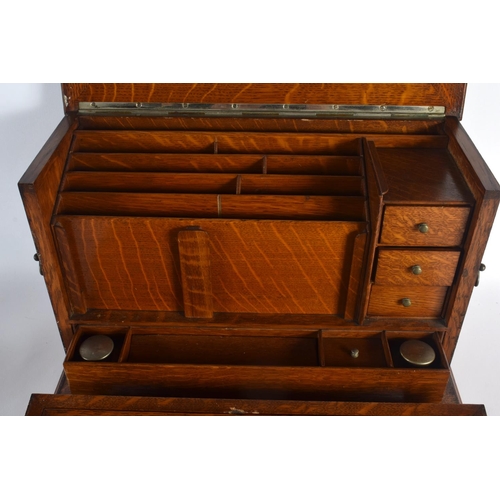 410 - A LOVELY LATE VICTORIAN GENTLEMAN'S OAK DESK CABINET the top rising, to reveal a fall front with pop... 