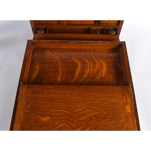 410 - A LOVELY LATE VICTORIAN GENTLEMAN'S OAK DESK CABINET the top rising, to reveal a fall front with pop... 