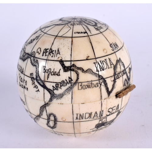 419 - A CONTEMPORARY CARVED SCRIMSHAW BONE GLOBE COMPASS. 10 cm wide.