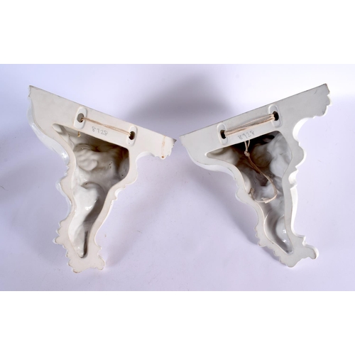 425 - A PAIR OF VINTAGE FRENCH WHITE GLAZED POTTERY WALL BRACKETS. 32 cm x 24 cm.