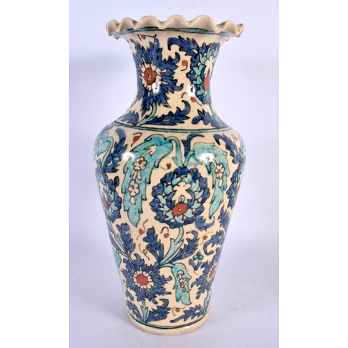 427 - A TURKISH MIDDLE EASTERN FAIENCE POTTERY VASE painted with flowers. 29 cm high.