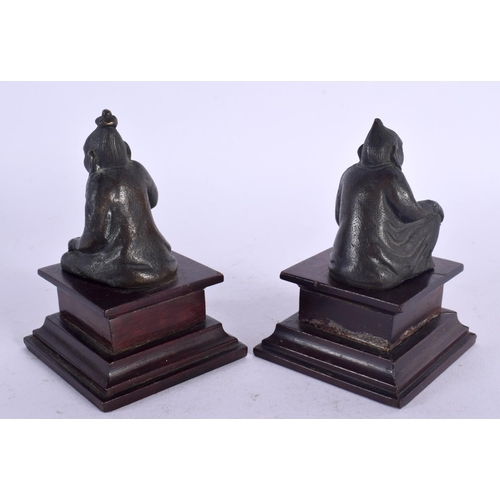 436 - A SMALL PAIR OF 19TH CENTURY MIDDLE EASTERN BRONZE FIGURES depicting buddhas 11 cm high.