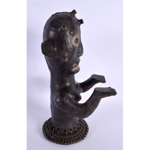 438 - AN EARLY 20TH CENTURY AFRICAN TRIBAL SKIN COVERED FERTILITY FIGURE. 30 cm x 10 cm.