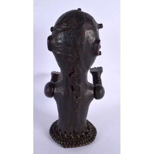 438 - AN EARLY 20TH CENTURY AFRICAN TRIBAL SKIN COVERED FERTILITY FIGURE. 30 cm x 10 cm.