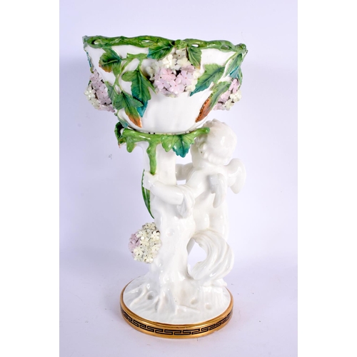 44 - A 19TH CENTURY ENGLISH MOORES POTTERY CHERUB VASE overlaid with foliage. 27 cm x 11 cm.