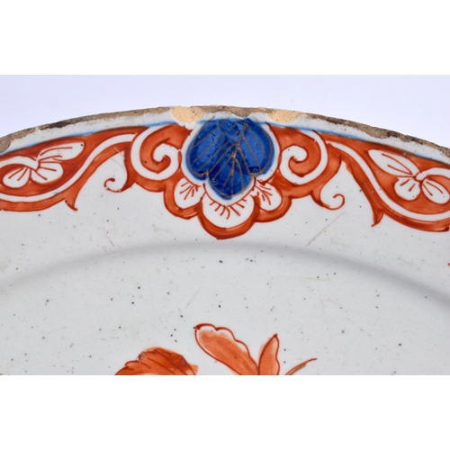 45 - A RARE 18TH CENTURY DELFT IMARI TIN GLAZED ENAMEL PLATE painted with a bird perched amongst flowerin... 