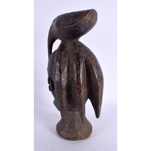 457 - AN AFRICAN TRIBAL CARVED BIRD OVERLAID MASK. 27 cm high.