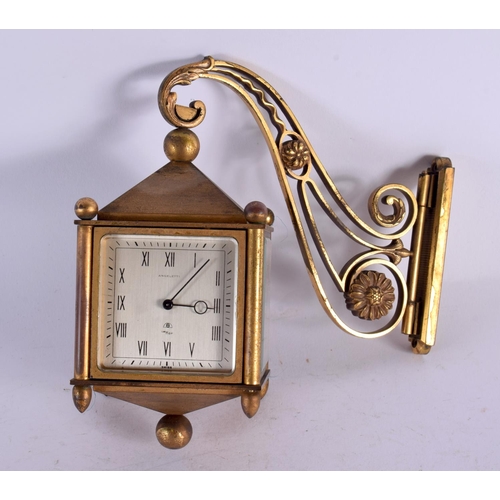 481 - AN UNUSUAL VINTAGE ANGELETTI FOUR SIDED BRASS CLOCK. 15 cm x 18 cm.