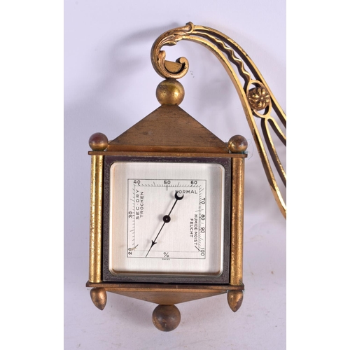 481 - AN UNUSUAL VINTAGE ANGELETTI FOUR SIDED BRASS CLOCK. 15 cm x 18 cm.