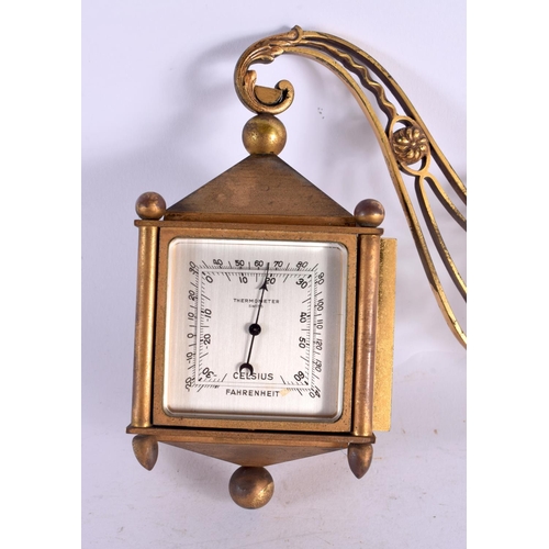 481 - AN UNUSUAL VINTAGE ANGELETTI FOUR SIDED BRASS CLOCK. 15 cm x 18 cm.