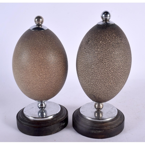 484 - A PAIR OF EARLY 20TH CENTURY AUSTRALIAN ABORIGINAL EMU EGGS. 20 cm high.