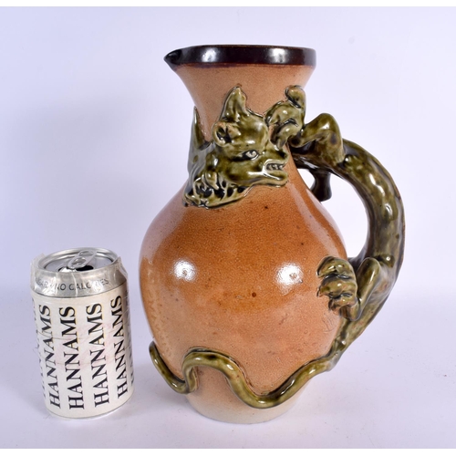 548 - A LARGE ANTIQUE ENGLISH STONEWARE JUG in the manner of Martin Brothers. 27 cm x 15 cm.