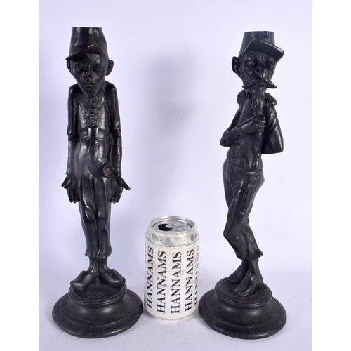 553 - A PAIR OF EARLY 20TH CENTURY CONTINENTAL PATINATED METAL CANDLESTICKS. 35 cm high.
