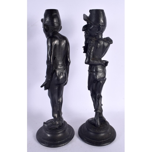 553 - A PAIR OF EARLY 20TH CENTURY CONTINENTAL PATINATED METAL CANDLESTICKS. 35 cm high.