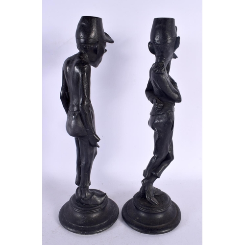 553 - A PAIR OF EARLY 20TH CENTURY CONTINENTAL PATINATED METAL CANDLESTICKS. 35 cm high.