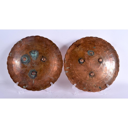 56 - A PAIR OF 19TH CENTURY MIDDLE EASTERN EGYPTIAN STYLE SILVER INLAID DISHES decorated with figures. 22... 