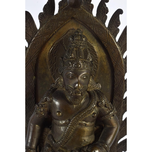 563 - A GOOD 19TH CENTURY INDIAN BRONZE FIGURE OF A STANDING BUDDHA modelled upon a rectangular base. 27 c... 