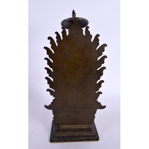 563 - A GOOD 19TH CENTURY INDIAN BRONZE FIGURE OF A STANDING BUDDHA modelled upon a rectangular base. 27 c... 