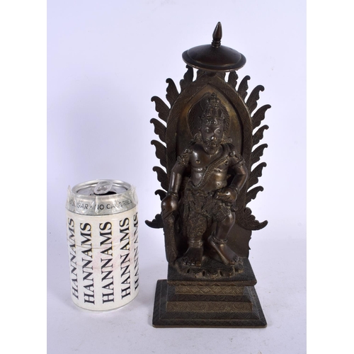 563 - A GOOD 19TH CENTURY INDIAN BRONZE FIGURE OF A STANDING BUDDHA modelled upon a rectangular base. 27 c... 